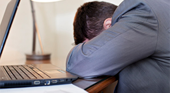 Man Sleeping at His Desk